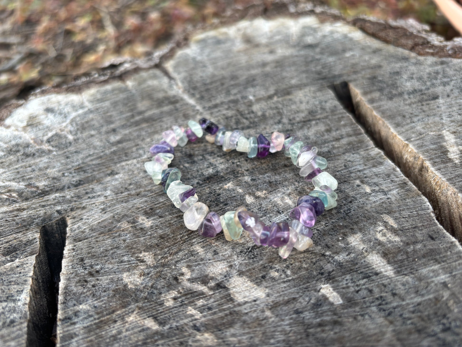 Multicolored beaded bracelet on a wooden surface